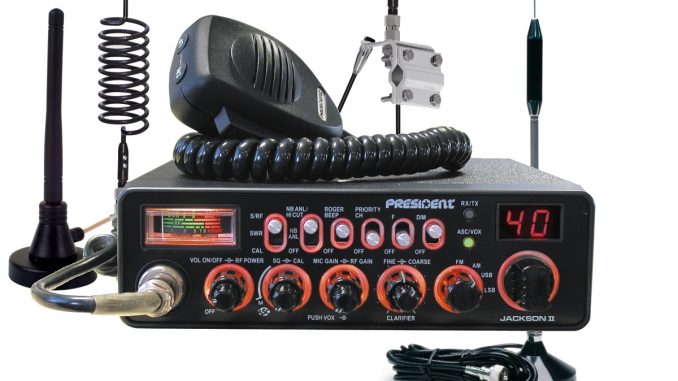 A colourful of technology. with a large aerial, desktop sized, with a speaker and microphone. It's a CD radio system
