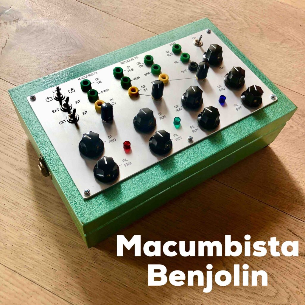 A strange green metal box sits on the floor. The top of the box features a series of neatly arranged black knobs and switches. Underneath the image in bold white type it says MACUMBISTA BENJOLIN