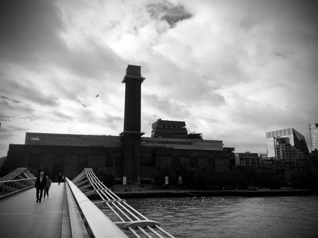 Tate Modern gallery in London, in black and white. Very dramatic image taken from the Millennium Bridge