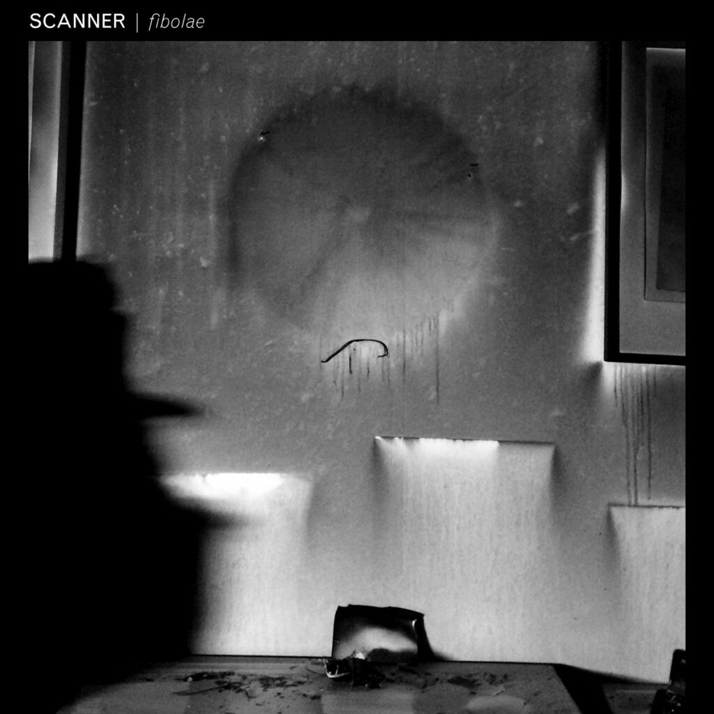 Black and white image of an album sleeve, with abstract cover, of shapes, circles and squares softly melted in a room. Across the top left it reads Scanner Fibolae
