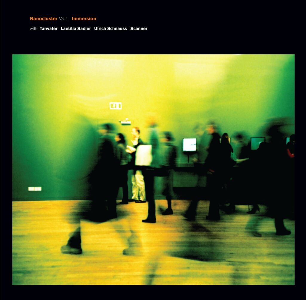 An album cover, with a distorted blurred image of people walking in a museum with a bright yellow tone to the image. Text at the top reads "Nanocluster Vol1 Immersion"