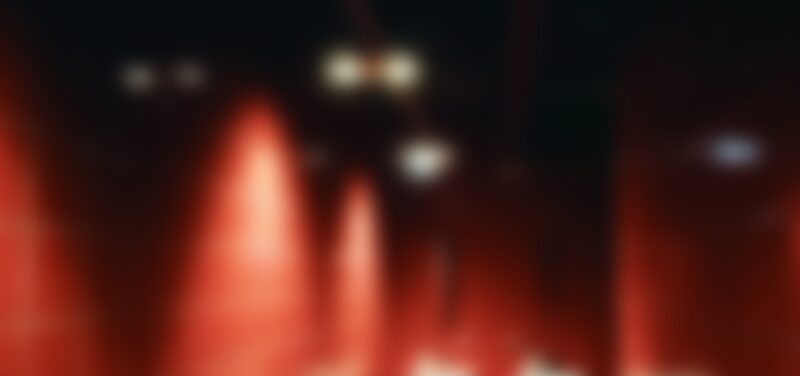 A blurry image with red light and dark colours, very abstract