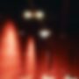 A blurry image with red light and dark colours, very abstract