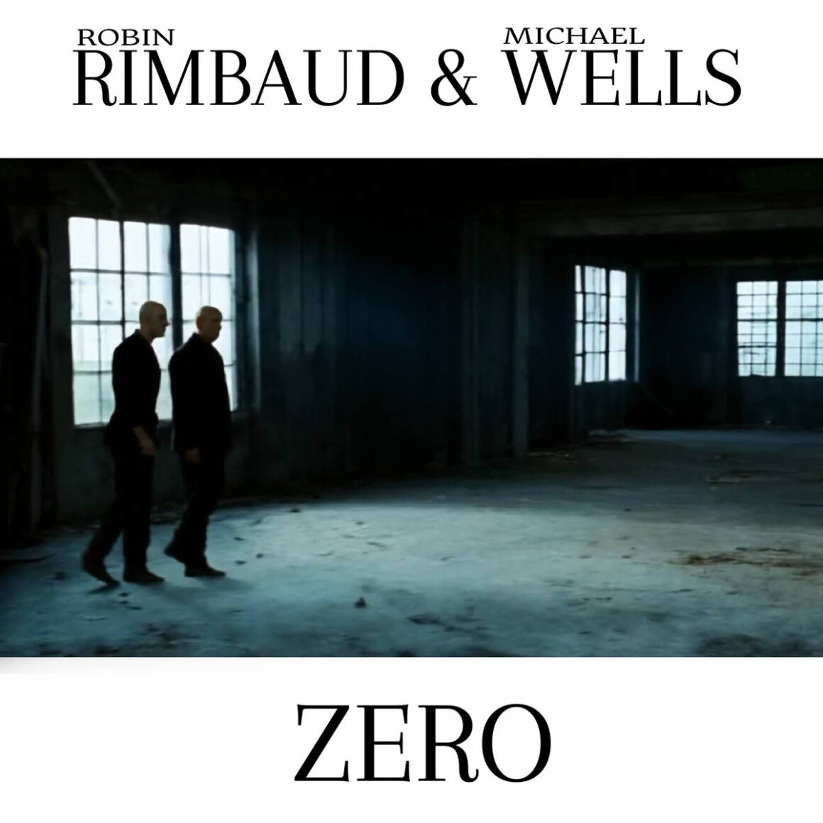 Album cover for Rimbaud and Wells, featuring two bald men in an industrial space, walking across this huge empty room.